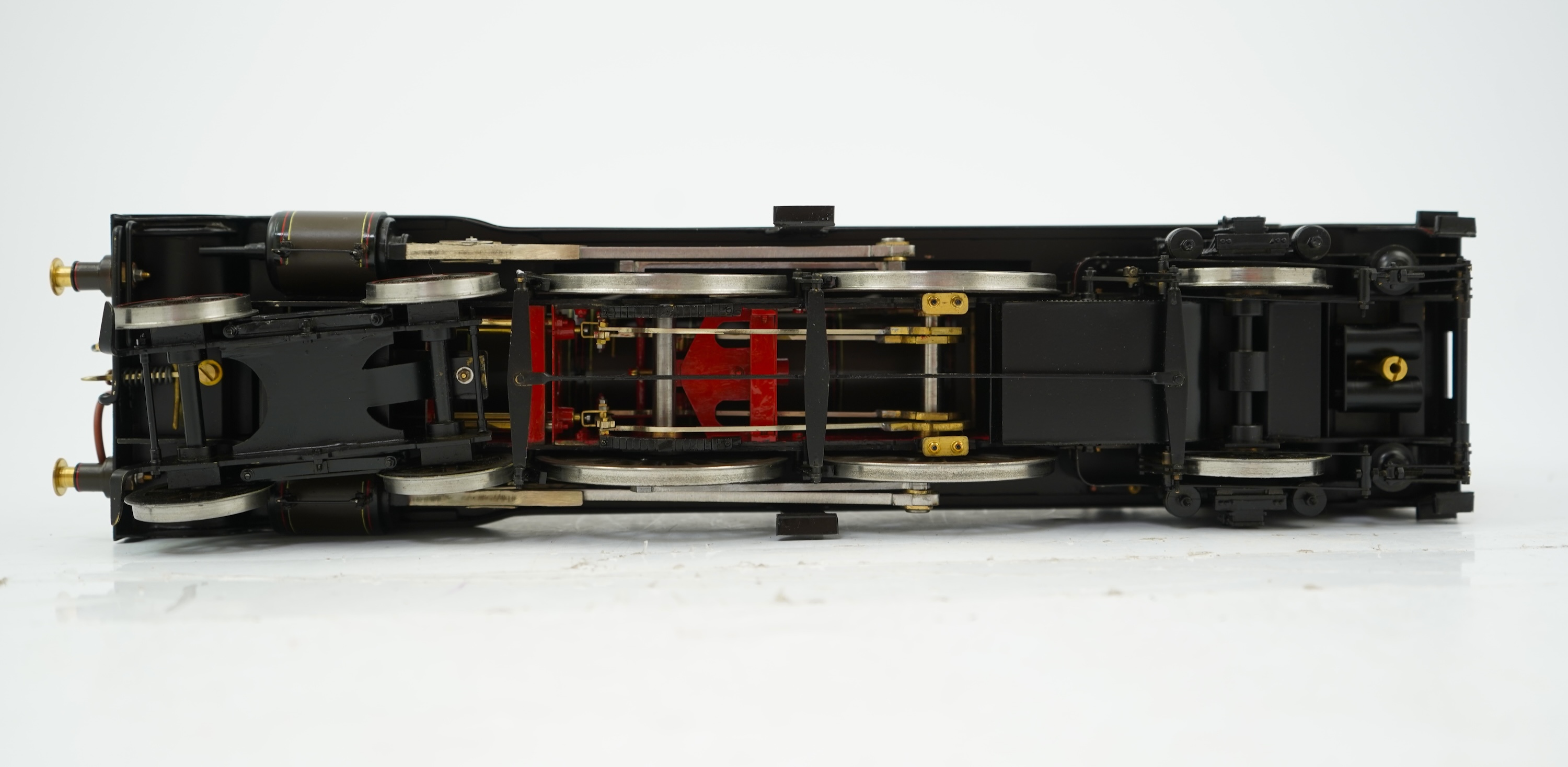 A Gauge One model of North British Railways H Class Auld Reekie 872, 4-4-2 Atlantic tender locomotive, the model has been left unpowered to allow for a high level of detailing of the valve gear and cylinders between the